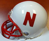 ERIC CROUCH, MIKE ROZIER & JOHNNY RODGERS AUTOGRAPHED NEBRASKA CORNHUSKERS MINI HELMET HEISMAN WINNERS WITH INSCRIPTIONS PSA/DNA ITP STOCK #103895